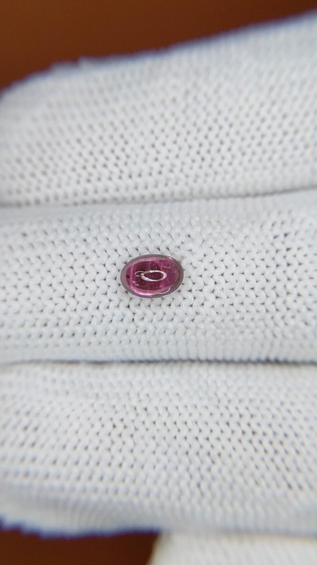 0.60 Ct. Pinkish Purple Cabochon Garnet from Ceylon (Sri Lanka) Size Video