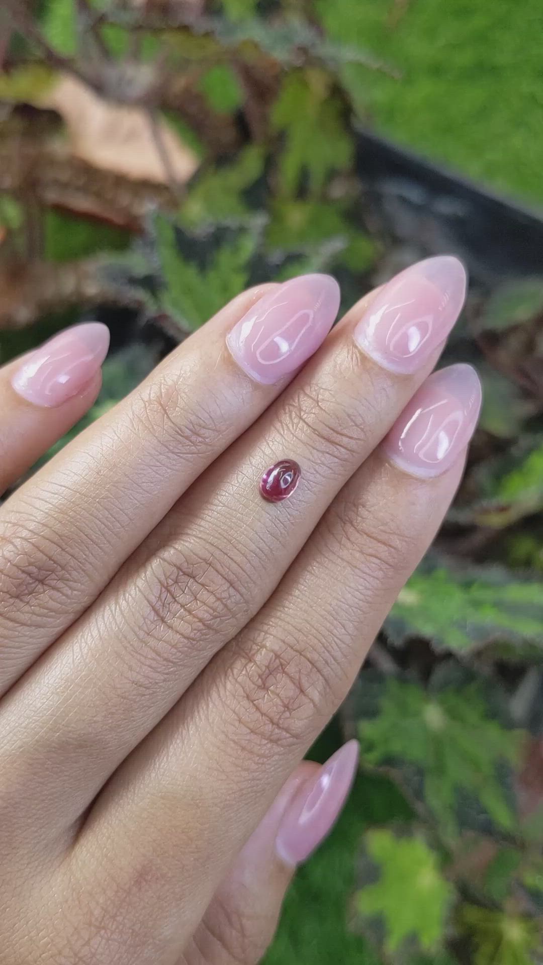 0.69 Ct. Pinkish Purple Cabochon Garnet from Ceylon (Sri Lanka) Size Video